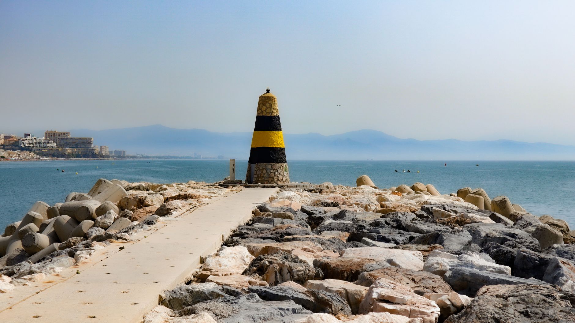 Seacoast in Benalmádena with a distinctive maritime bollard.