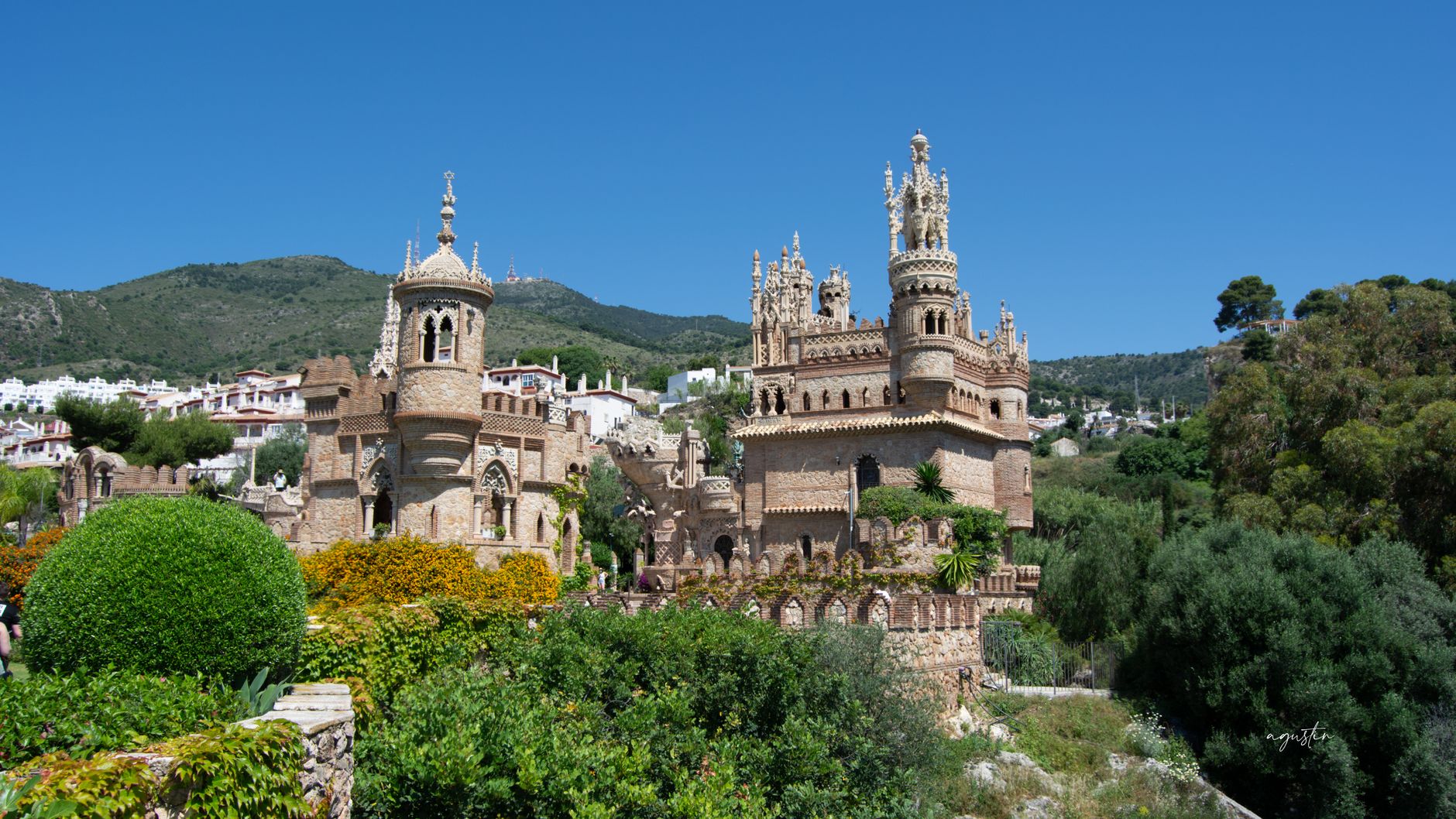 The ornate Castillo de Colomares in Benalmádena under a bright blue sky.