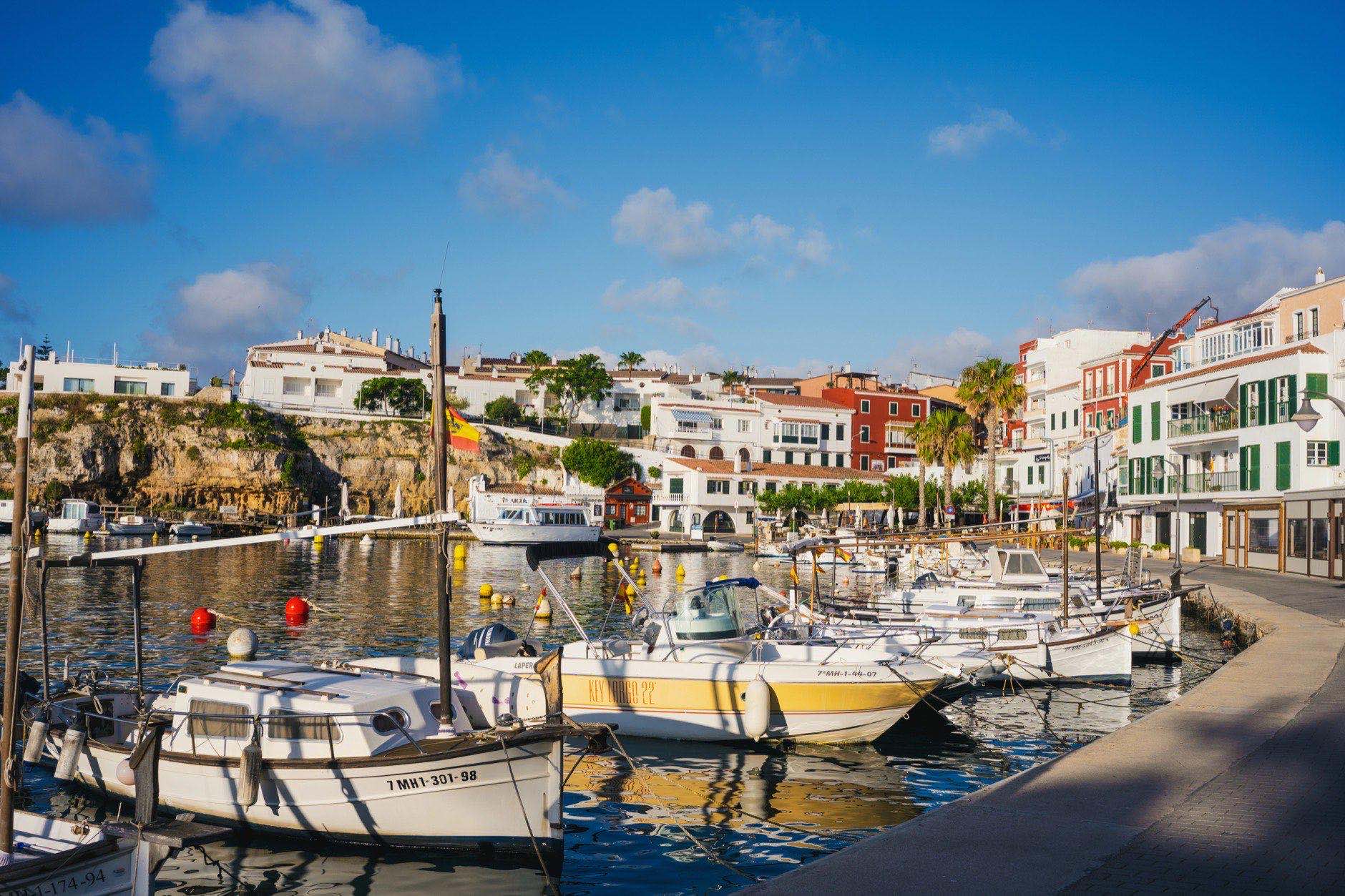 View of Cales Fonts port in the morning with small boats and restaurants in the city of Mahon and Es Castell in the island of Menorca in the balearic islands of Spain