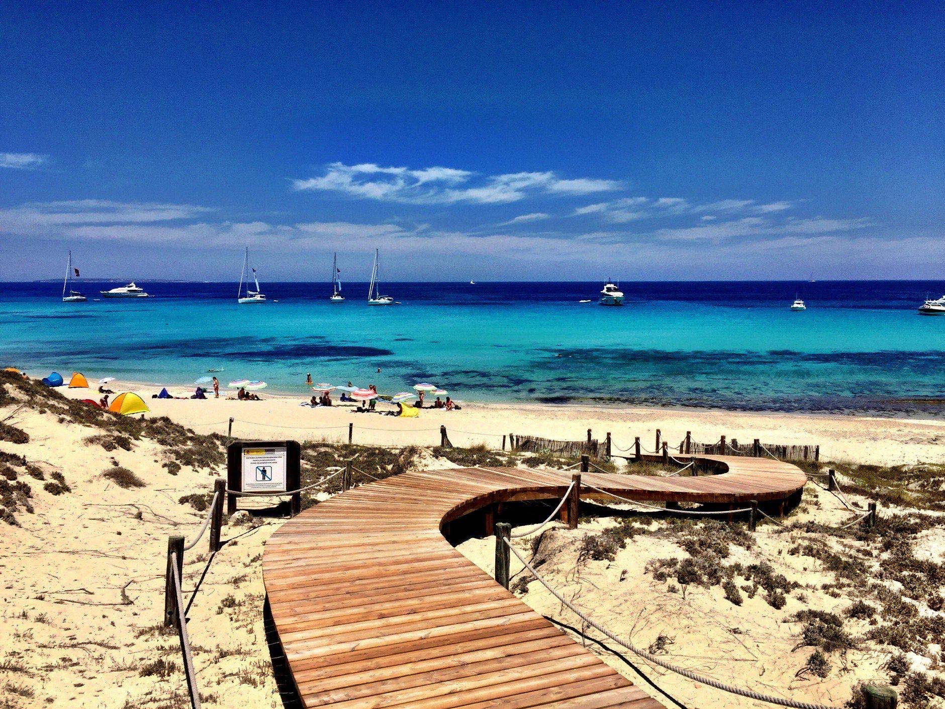 Beatiful Sunny Beach day in Formentera, Spain in the middle of the holiday summer season.