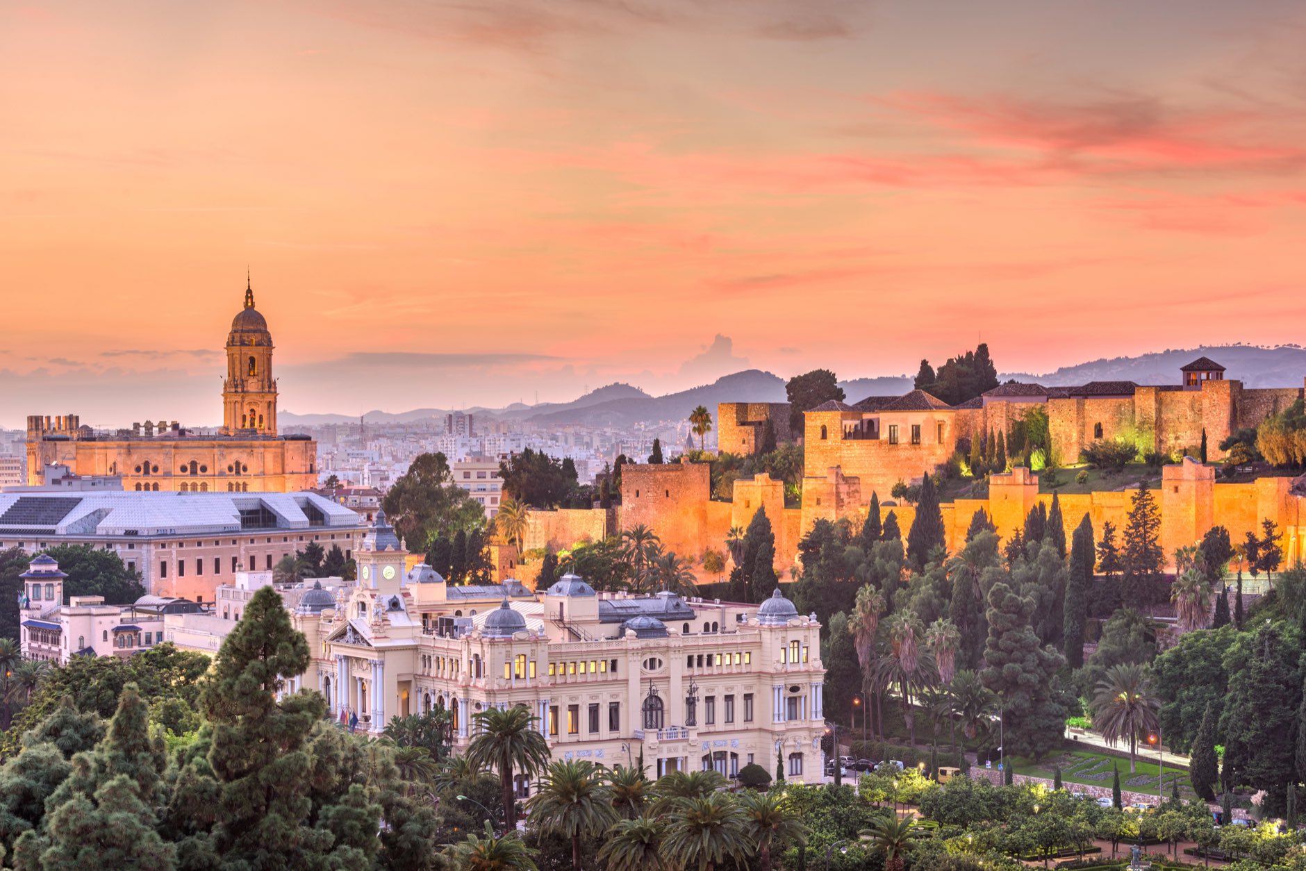 Malaga, Spain old town skyline at dusk.