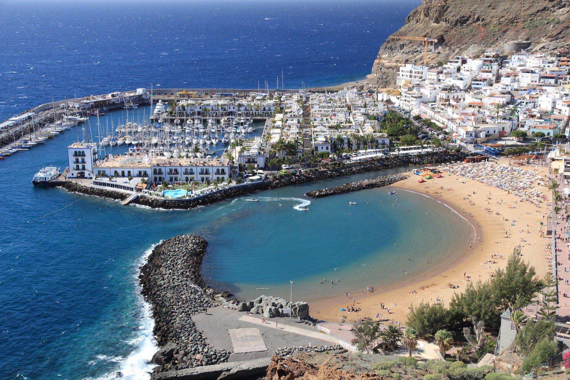 Puerto Mogan in Gran Canaria - aerial view of beach and Atlantic Ocean.