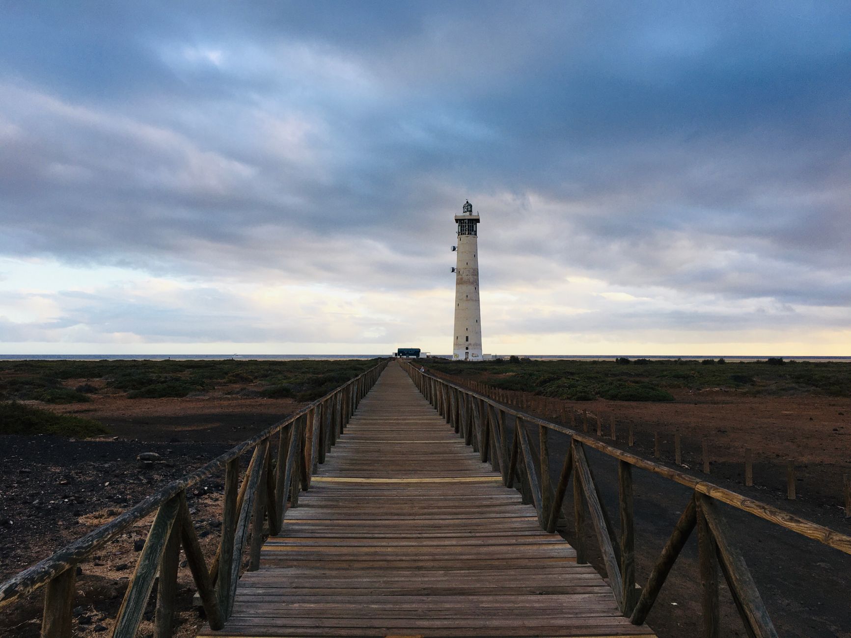 Morro Jable in the municipality of Pájara, Fuerteventura, Spain — A wooden walkway leading to Faro de Morro Jable lighthouse