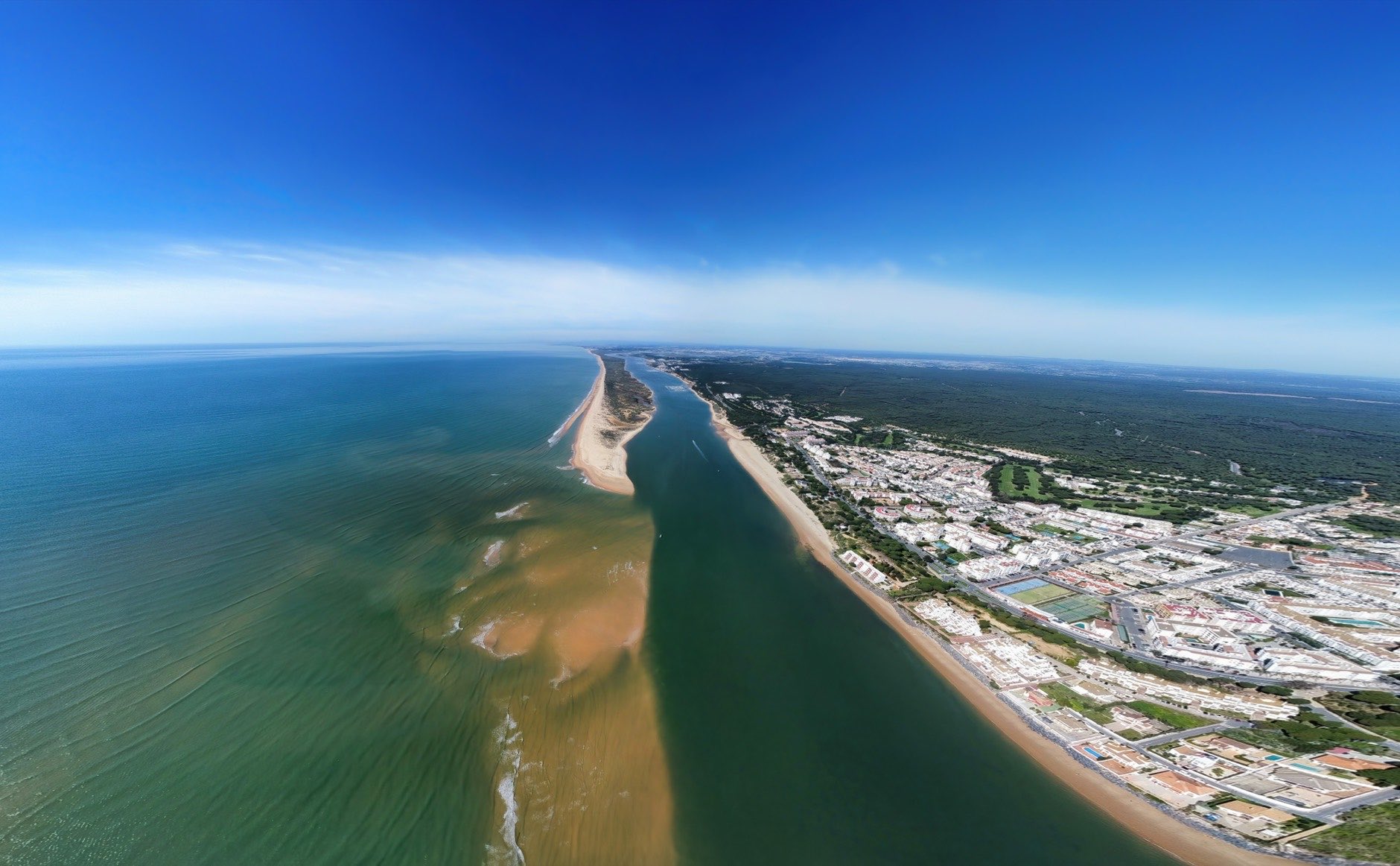Aerial view of the Rompido Arrow (La Flecha del Rompido), a sand bank formed on the Rompido and Portil beaches that already reaches La Bota beach, in the municipality of Punta Umbria, Huelva province