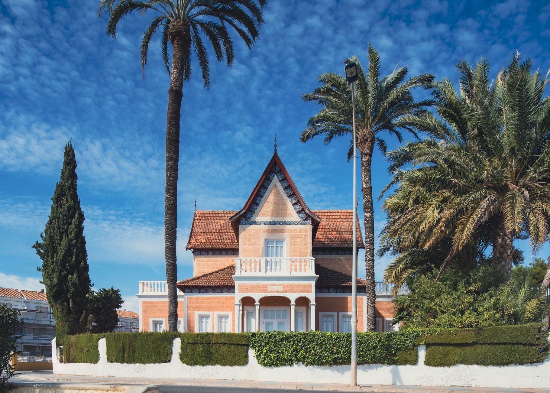 A Spanish villa surrounded by palm trees in San Javier, Spain.