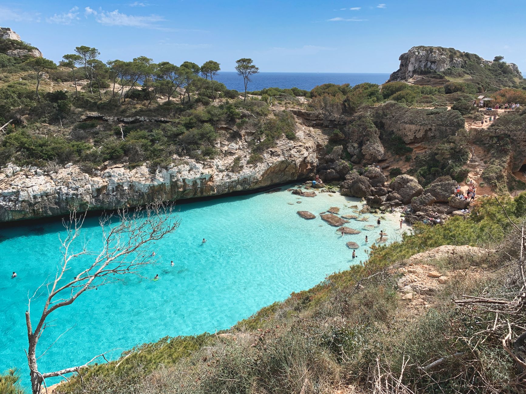 Discover the azure waters and rocky coastline of Sant Antoni de Portmany, Ibiza.