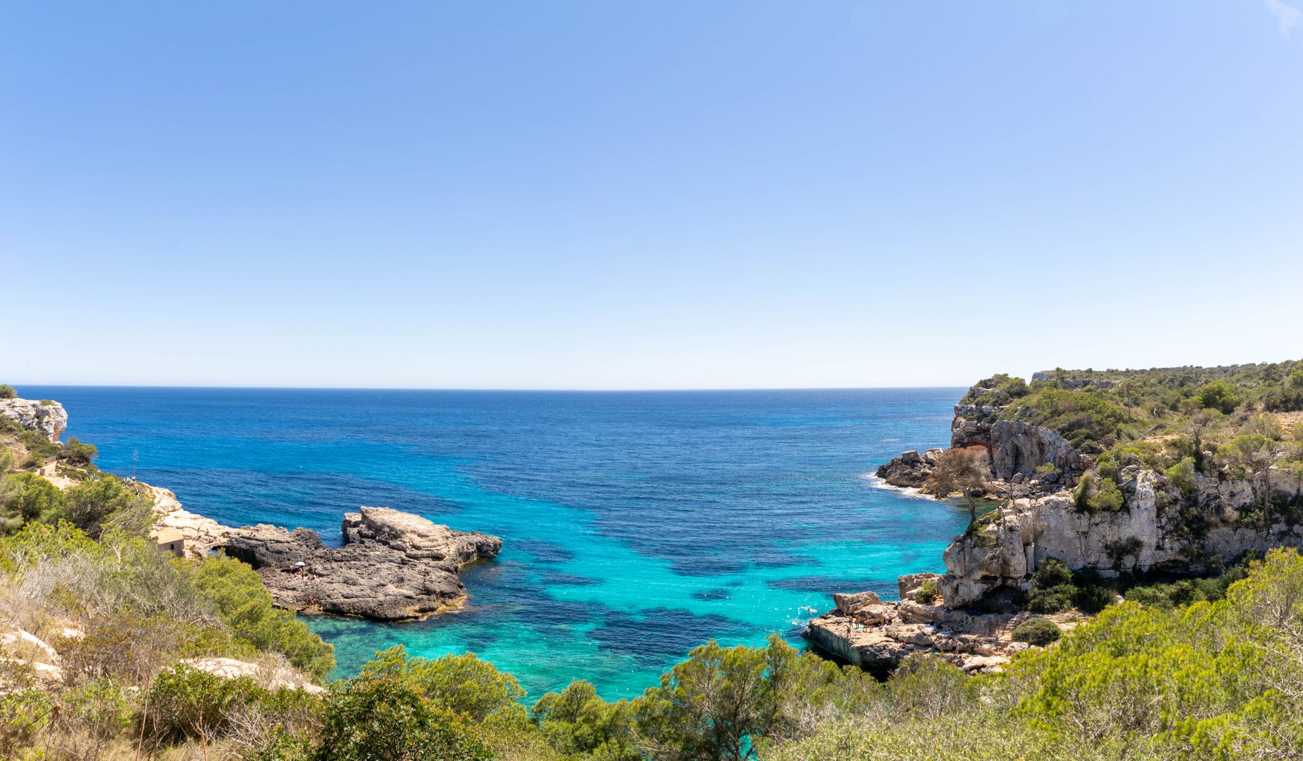 View of Sant Antoni de Portmany's turquoise sea and cliffs.