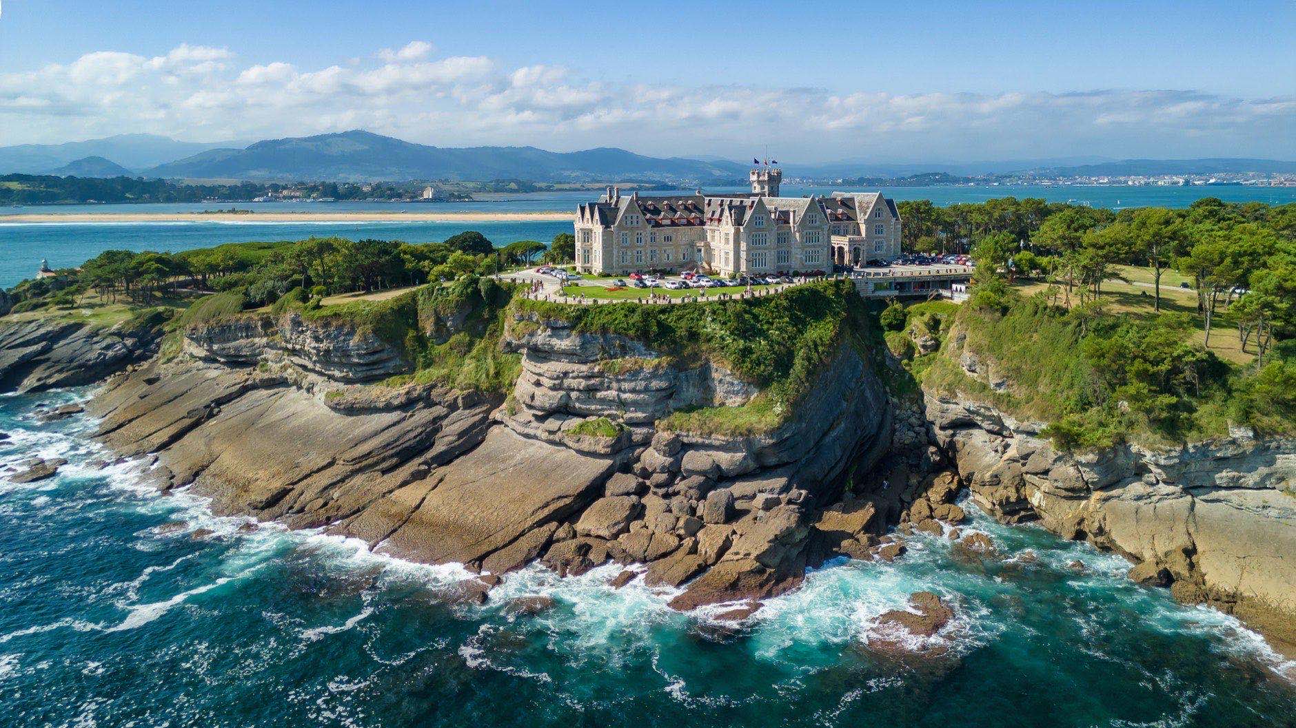 Magdalena Peninsula, Santander, Cantabria, northern Spain. Aerial view of Magdalena Palace in Santander city, during summer. A peninsula on the Cantabrian Sea with a rugged rocky coastline