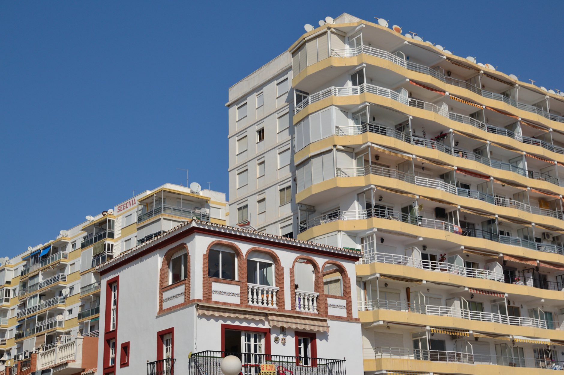 Small house amid tall buildings in Velez-Malaga,