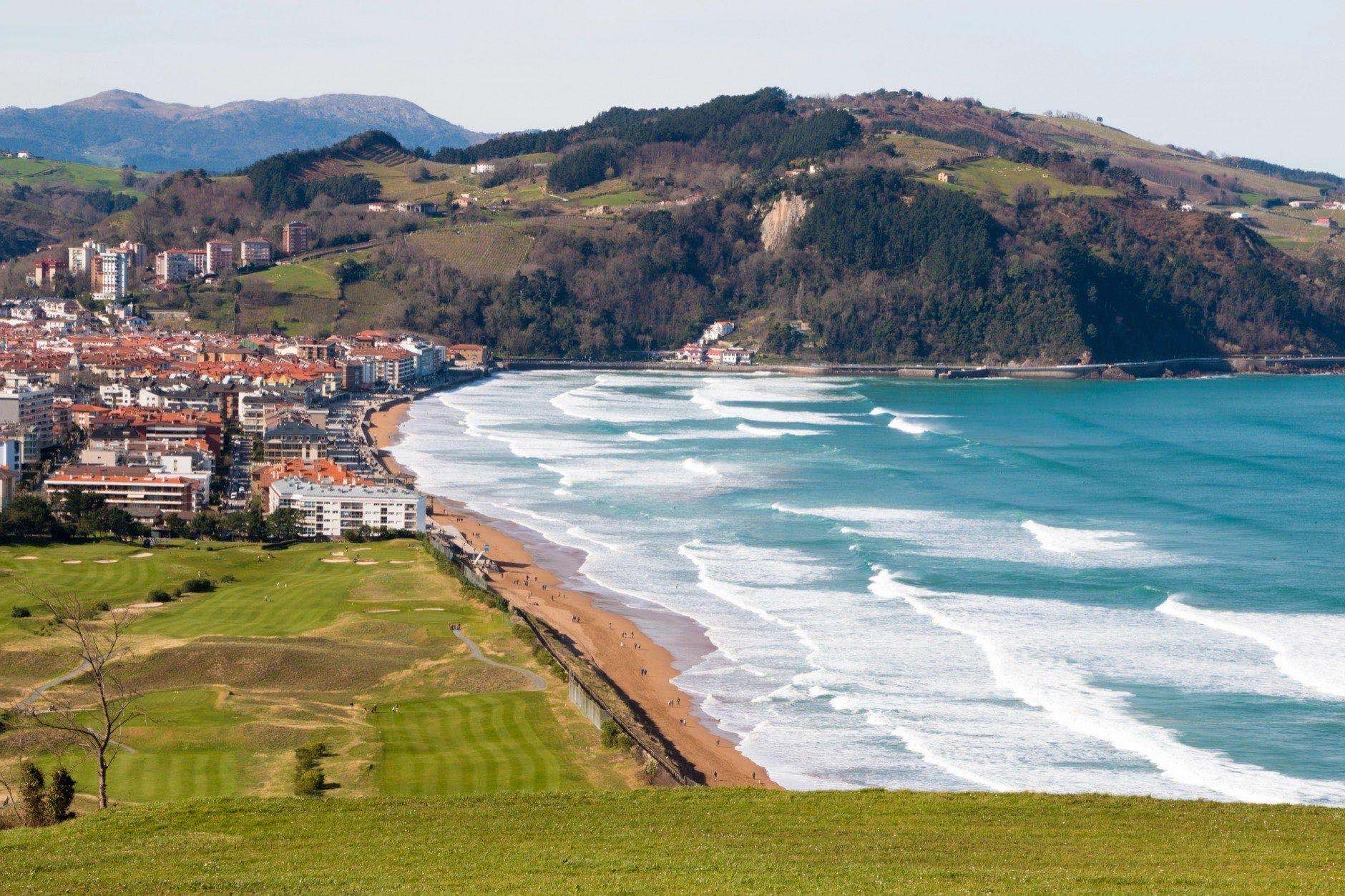View from the mountain of the village of Zarautz with its beach and the golf course in the foreground